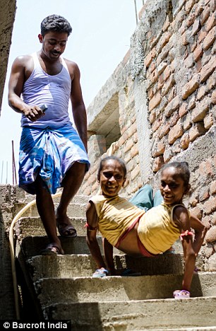 Ganga (right), who gets around with her sister by walking on their hands, said: 