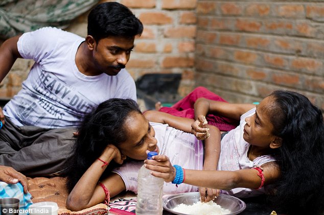 Close: The trio have now been together seven months and live in a village near Kolkata